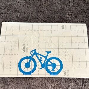 Blue Bicycle Decal with white mountain range behind it